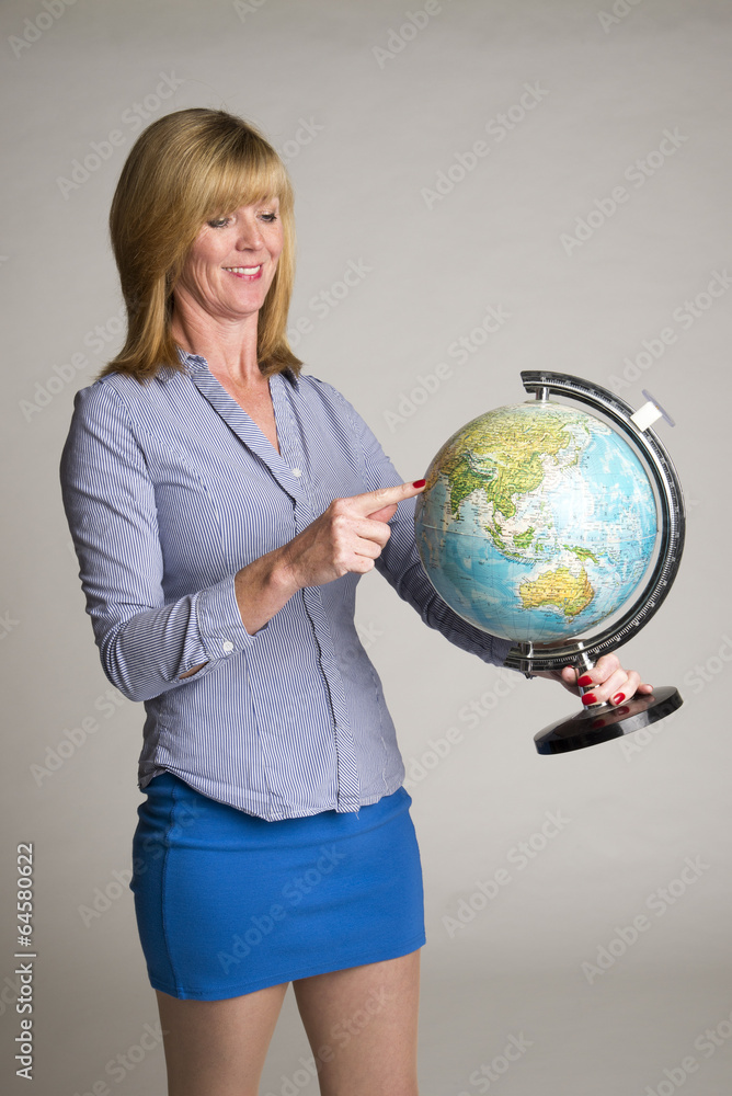 Woman holding a world globe