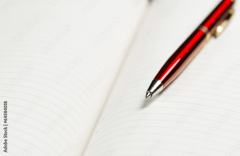 pen and open notepad pen and open notepad