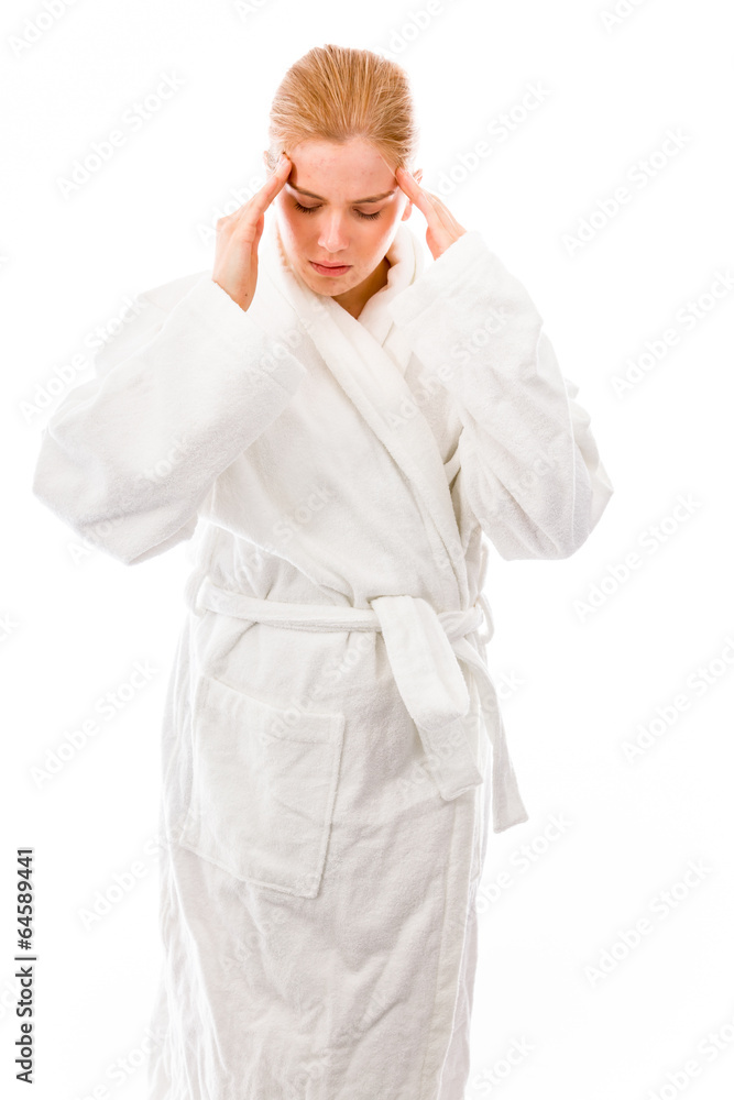 Young woman standing in bathrobe suffering from headache Young woman standing in bathrobe suffering from headache