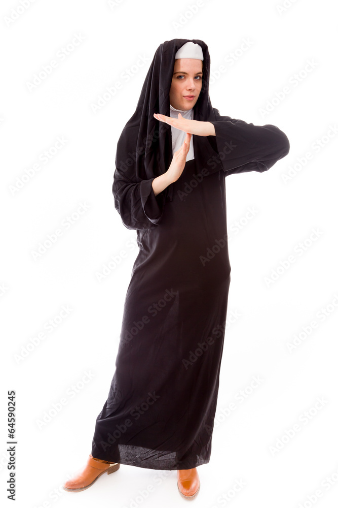 Young nun making time out signal with hands Young nun making time out signal with hands