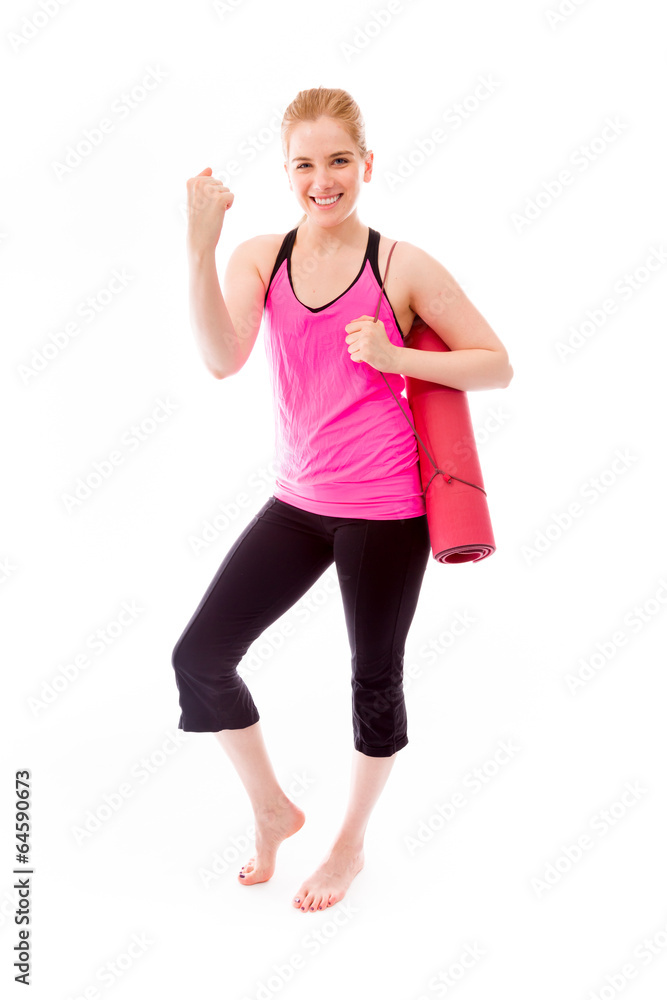 Young woman carrying exercising mat and celebrating success Young woman carrying exercising mat and celebrating success