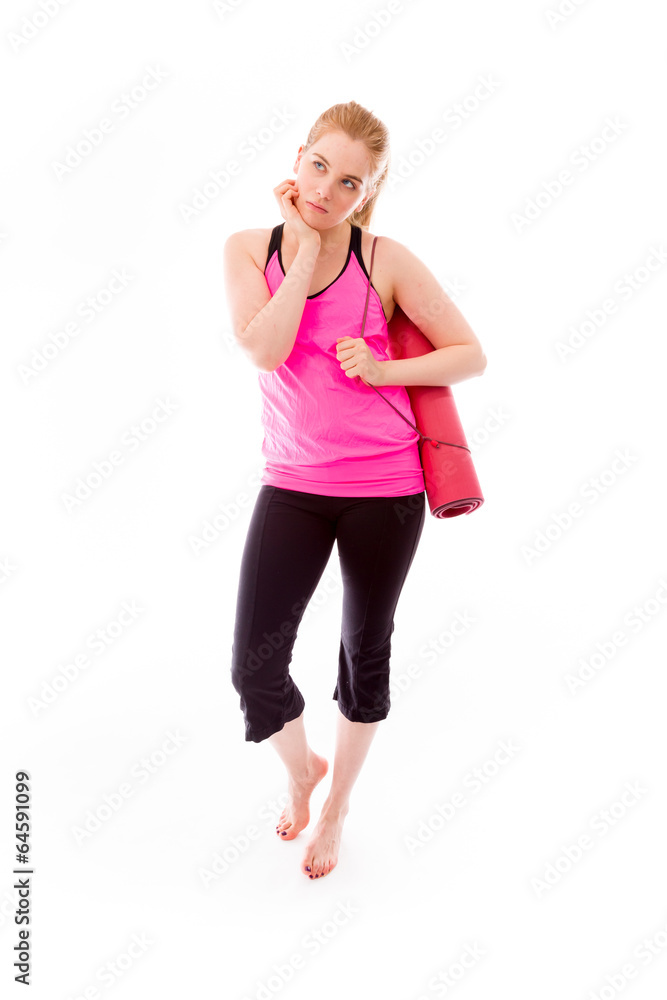 Young woman carrying exercising mat looking sad Young woman carrying exercising mat looking sad