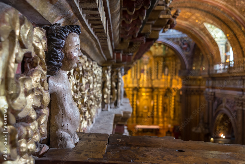 Fototapeta premium Little angel statue in a corner of an old church