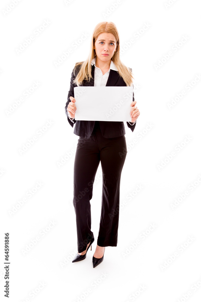 Disappointed businesswoman holding a blank placard Disappointed businesswoman holding a blank placard