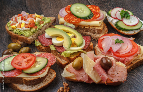 Collection of sandwiches on wooden table