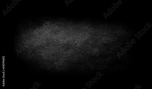 Black texture background with spotlight.