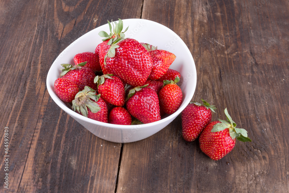 strawberries in a bowl on the table strawberries in a bowl on the table