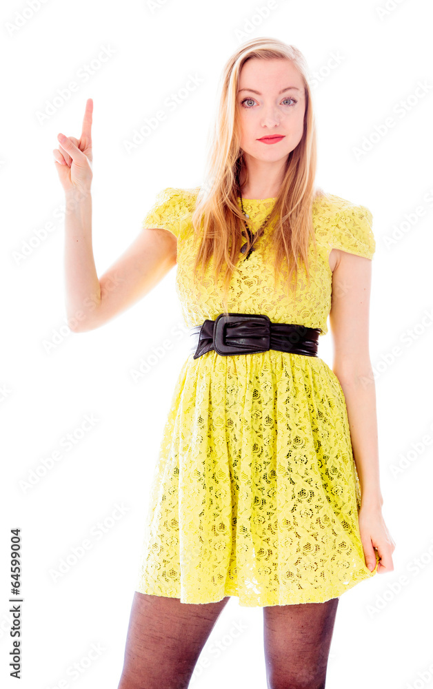 Beautiful young woman standing and pointing upward Beautiful young woman standing and pointing upward