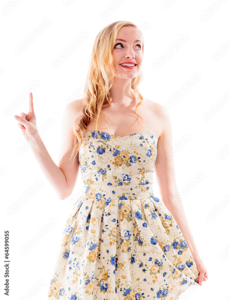 Beautiful young woman pointing upward Beautiful young woman pointing upward
