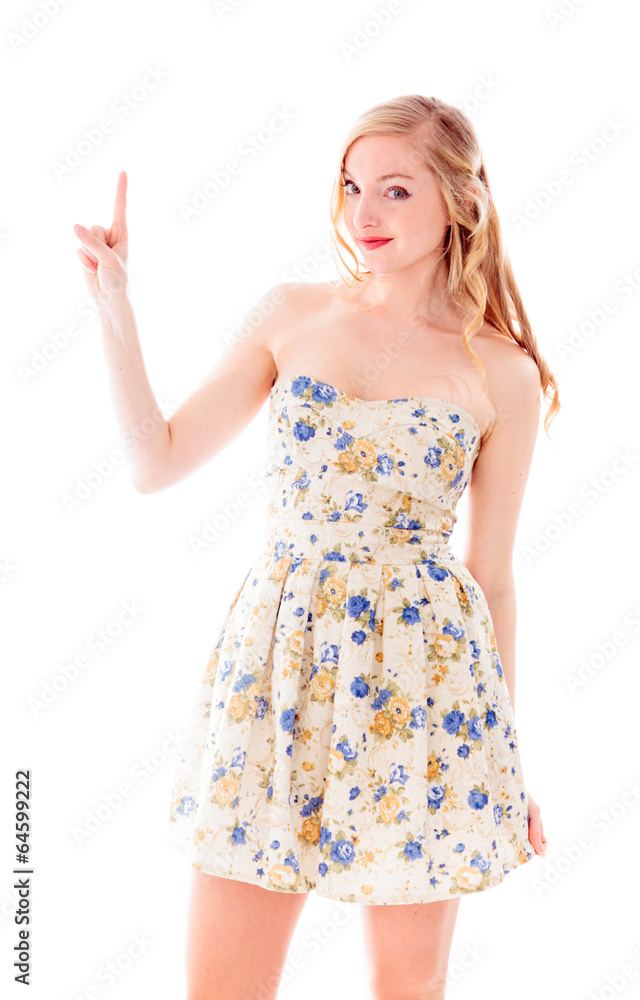 Beautiful young woman standing and pointing upward Beautiful young woman standing and pointing upward