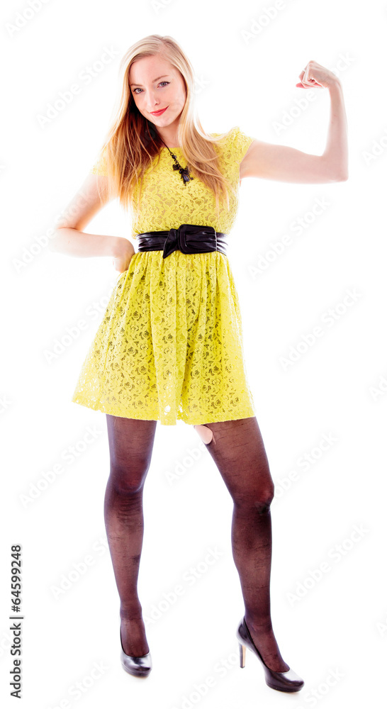 Beautiful young woman standing and flexing biceps