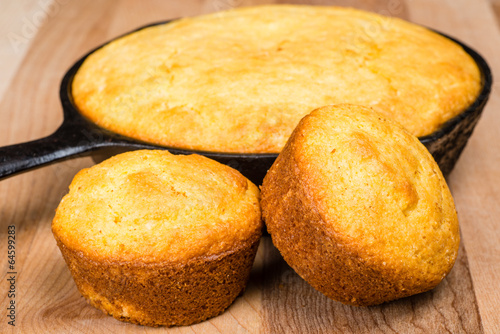 Cornbread muffins and cornbread pone in an iron skillet photo
