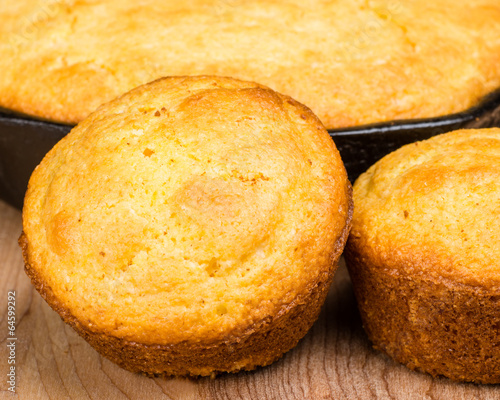 Cornbread muffins and cornbread pone in an iron skillet photo