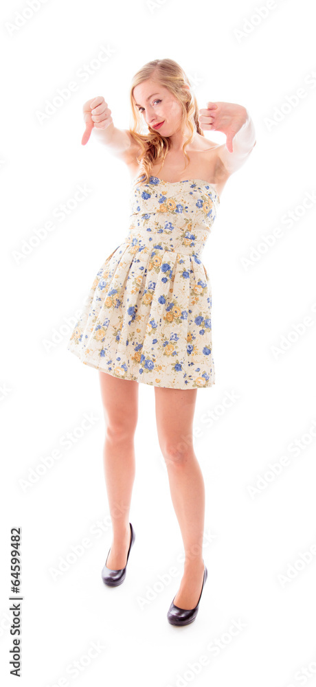 Young woman standing and showing thumbs down with both hands Young woman standing and showing thumbs down with both hands