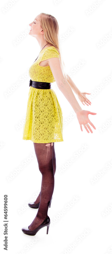 Beautiful young woman standing with arm outstretched Beautiful young woman standing with arm outstretched