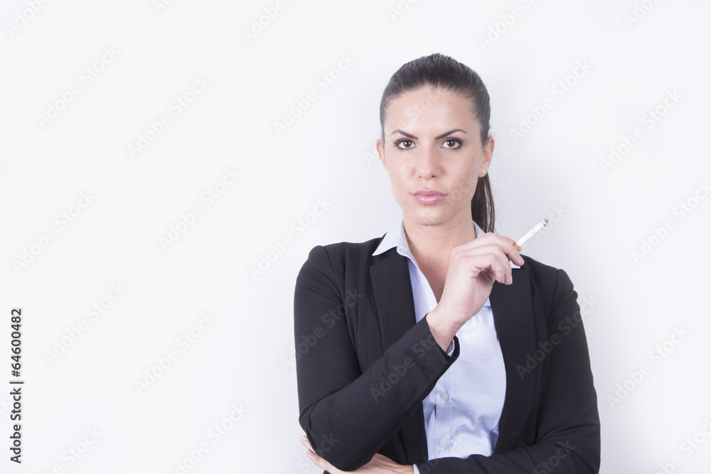 Business woman in a suit smoking a cigarette Business woman in a suit smoking a cigarette