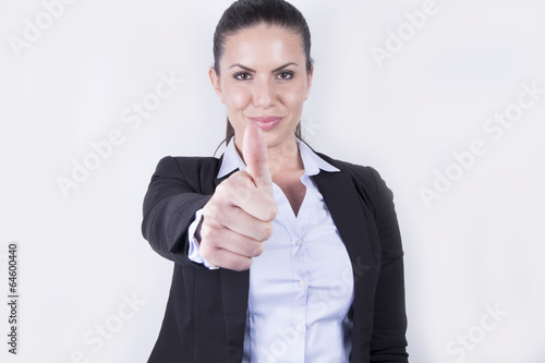 Attractive female - business woman showing thumbs-up