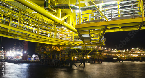 An offshore oil-platform at night © corlaffra