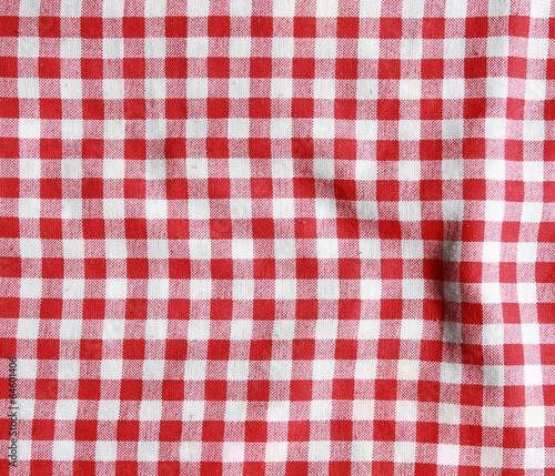 Red and white texture of a checkered picnic blanket.