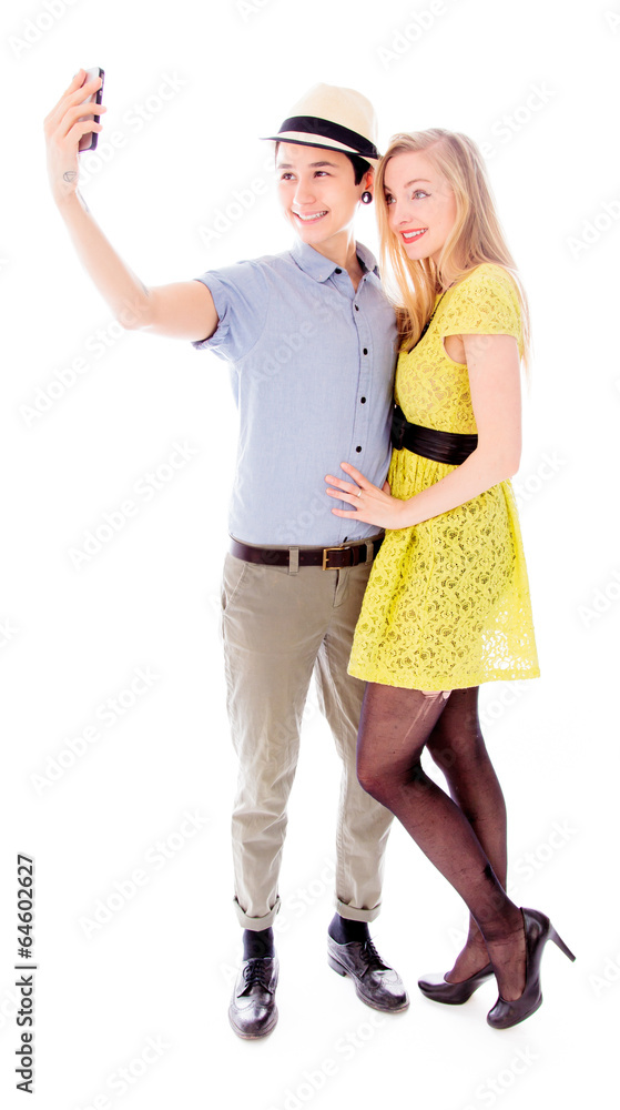 Lesbian couple taking picture of herself with a mobile phone Lesbian couple taking picture of herself with a mobile phone
