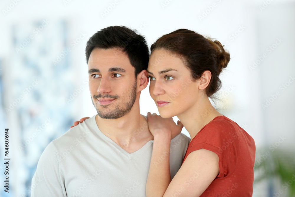 Portrait of loving couple looking away