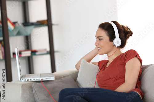 Woman with headphones chating on internet