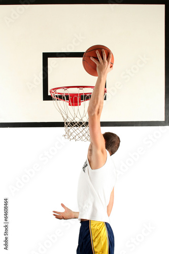 Young man playing basketball photo