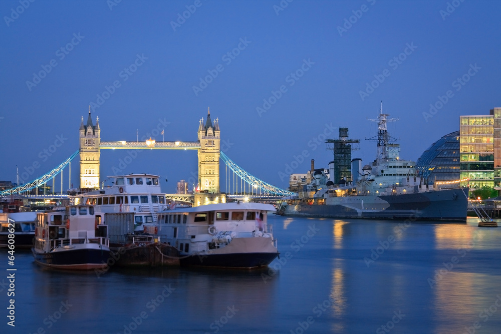 Tower bridge and HMS Belfast at dusk, London.