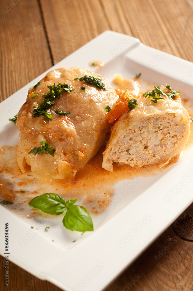 Closeup of stuffed cabbage rolls with tomato souce and herbs Closeup of stuffed cabbage rolls with tomato souce and herbs