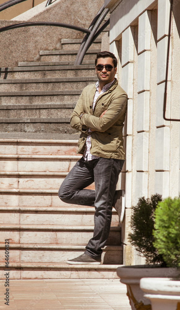 Obraz premium Young guy standing or posing, outdoor shot