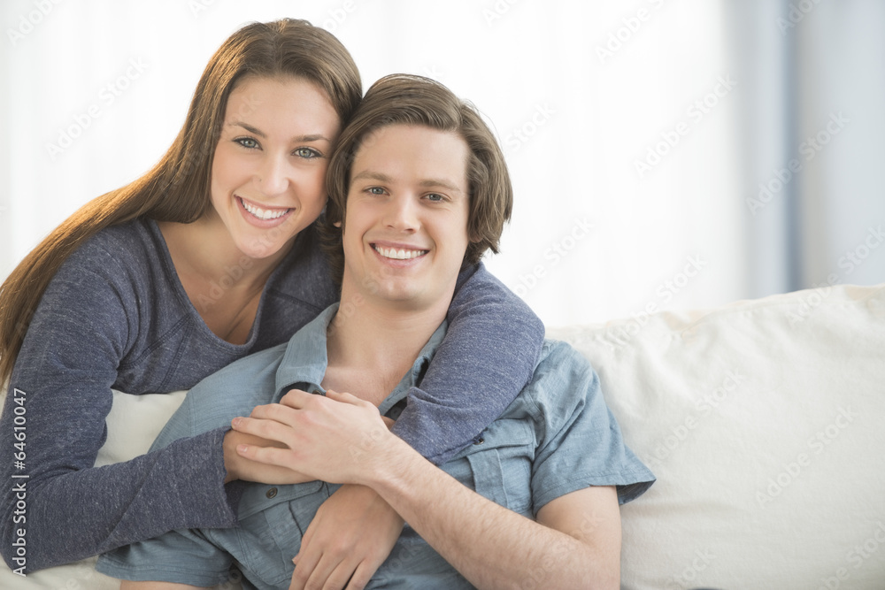 Loving Woman Embracing Man From Behind Loving Woman Embracing Man From Behind