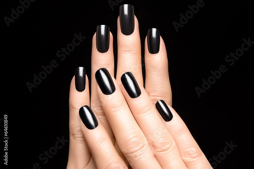 Woman hands with black nails photo