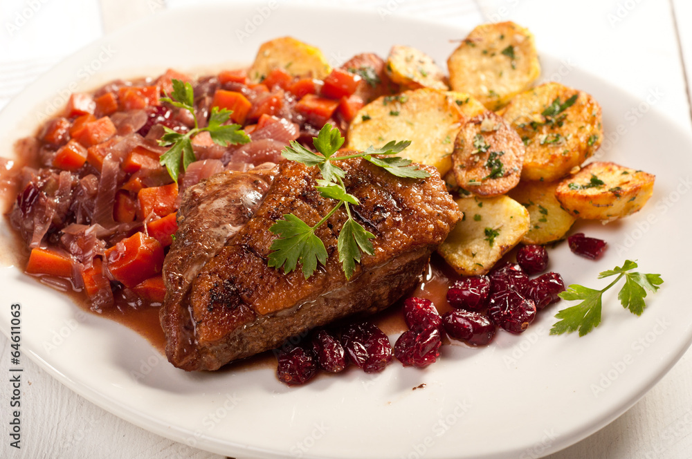 fillet of duck with roasted potatoes, vegetables and cranberry fillet of duck with roasted potatoes, vegetables and cranberry