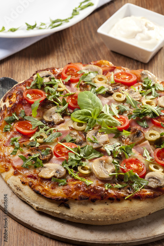 Pizza with ham and mushrooms