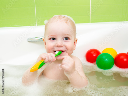 baby boy brushing teeth in ...