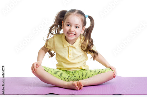 Cheerful kid girl doing exe...