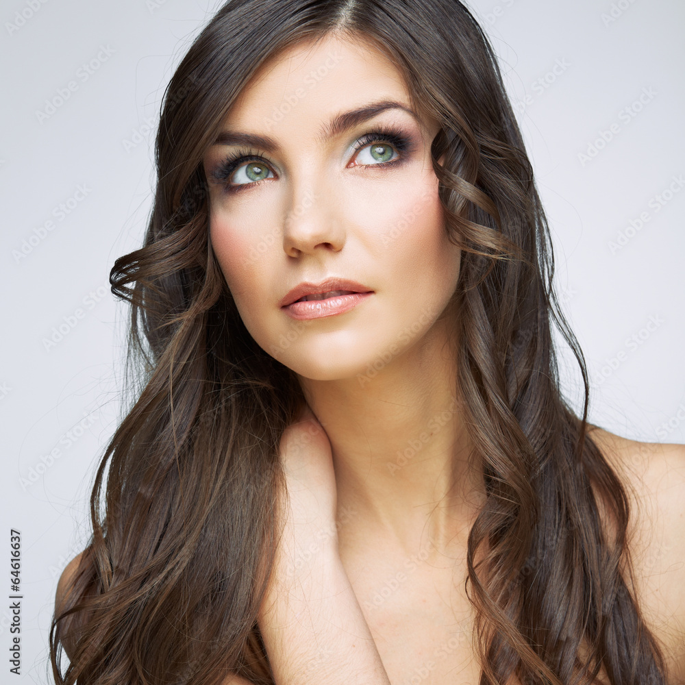 Fototapeta premium Woman face close up beauty portrait. Girl with long hair lookin