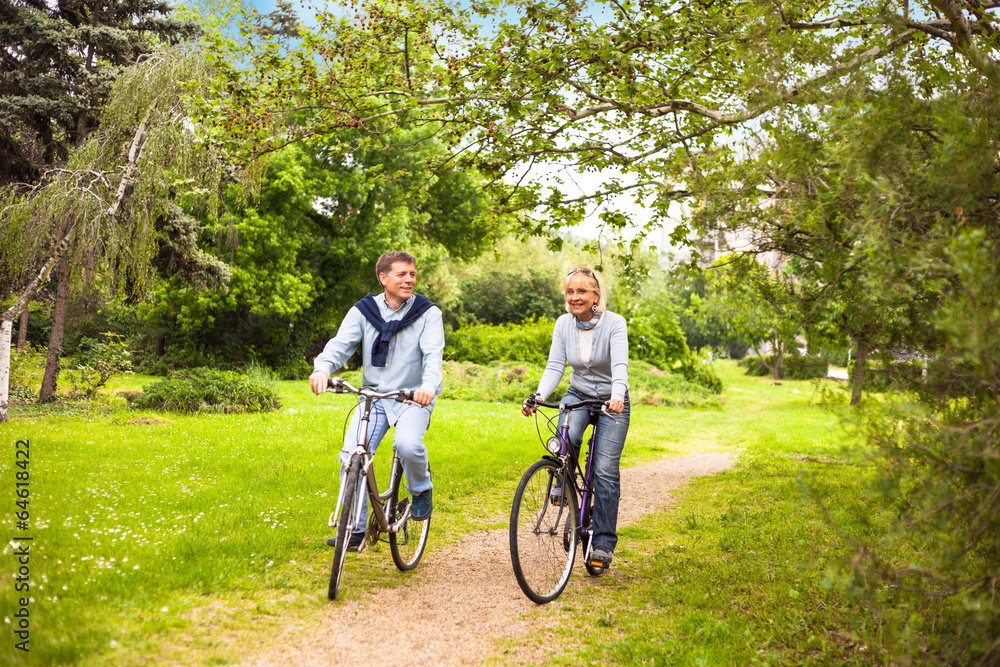 Fototapeta premium Senior couple on cycle ride in countryside