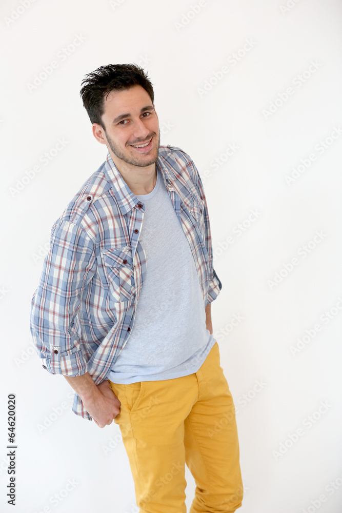 Trendy guy standing on white background Trendy guy standing on white background
