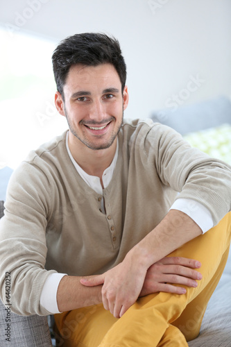 Portrait of young man relaxing at home