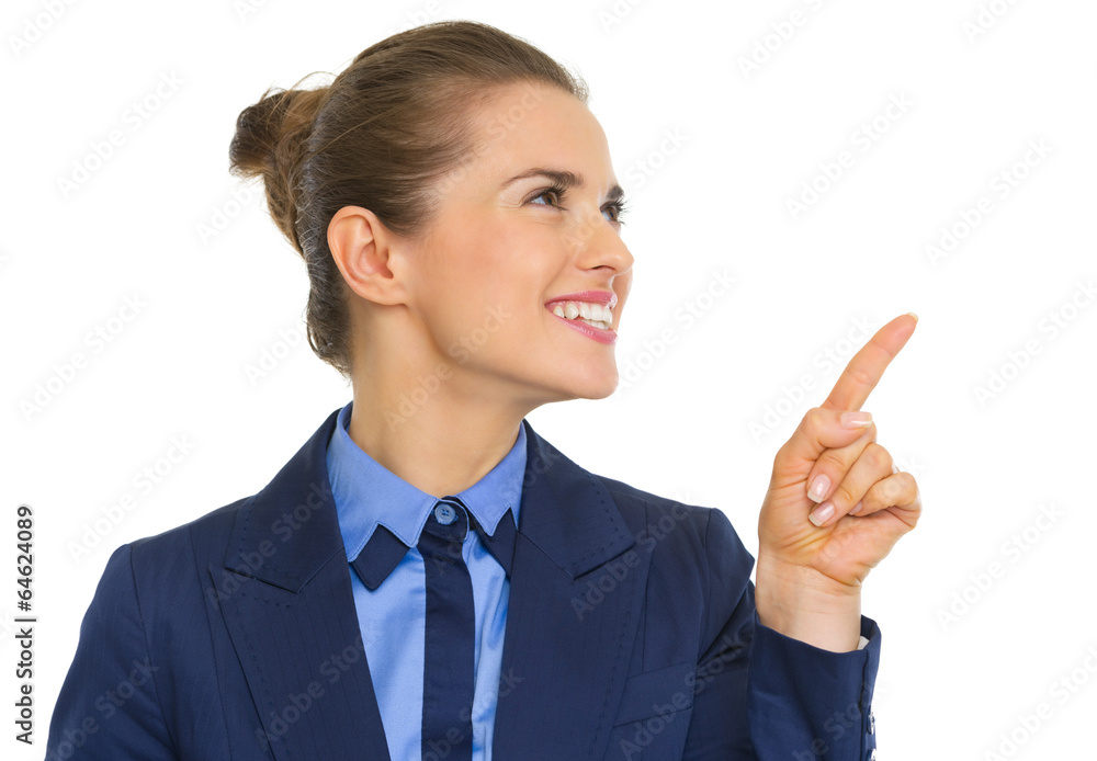 Smiling business woman pointing on copy space Smiling business woman pointing on copy space