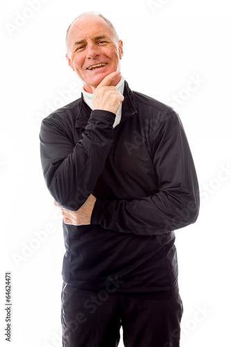 Senior man smiling with hand on chin