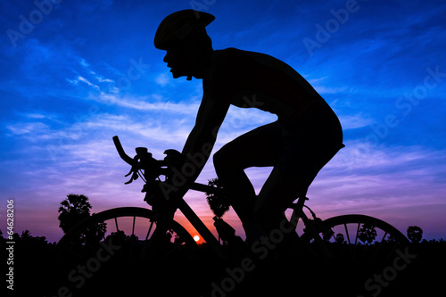 Man cycling on twilight