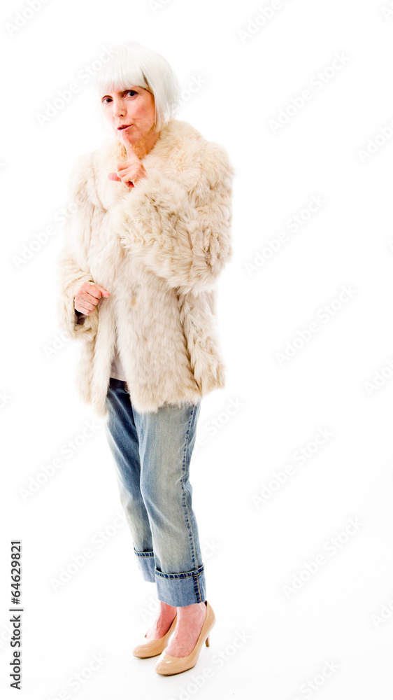 Obraz premium Senior woman with a finger on lips