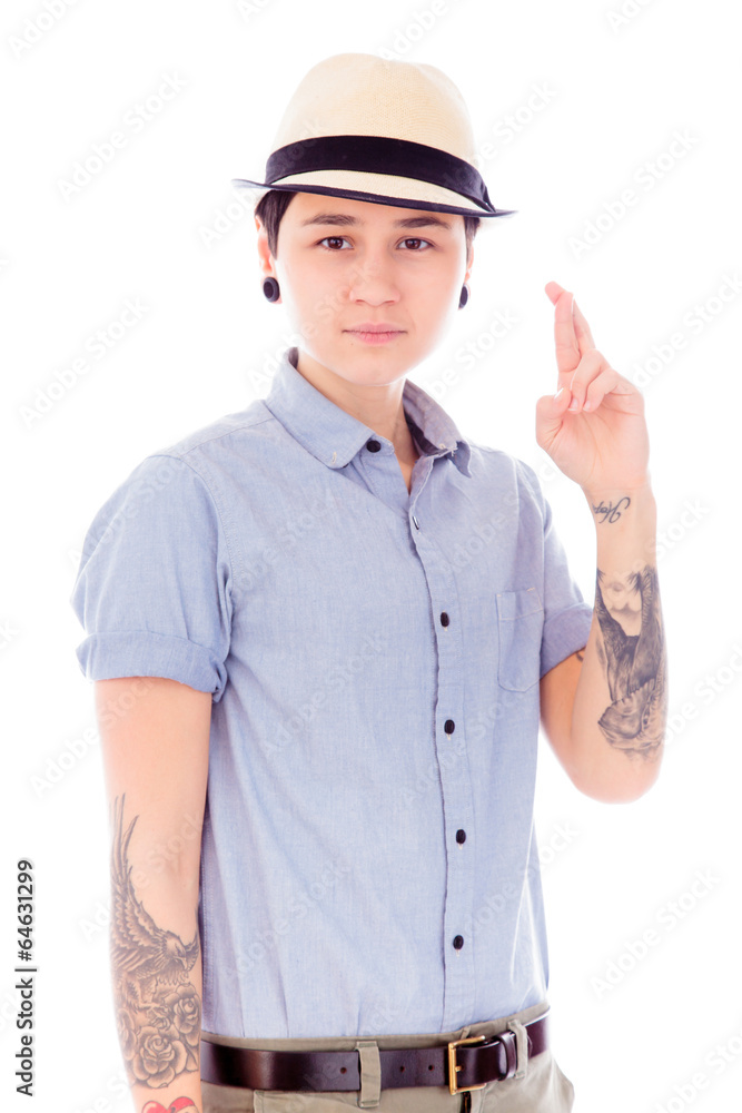 Young woman standing with her fingers crossed Young woman standing with her fingers crossed