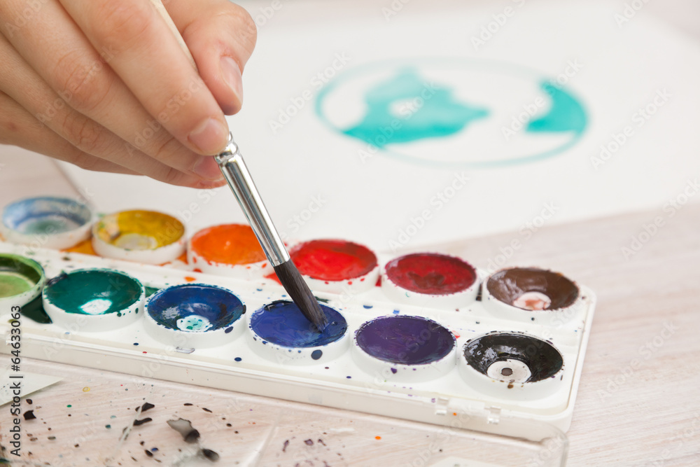 brush in the hands of the artist, watercolor painting, creativit brush in the hands of the artist, watercolor painting, creativit