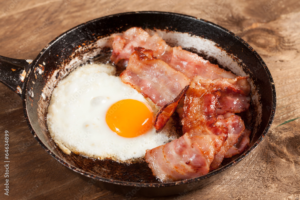 Fried egg and bacon. Fried egg and bacon.