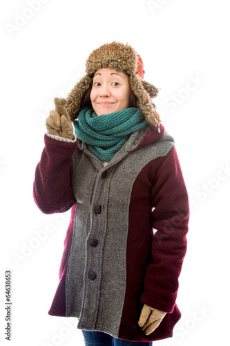 Young woman in warm clothing with her fingers crossed