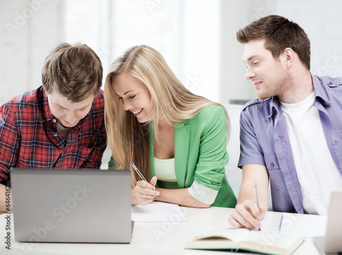 students writing something at school