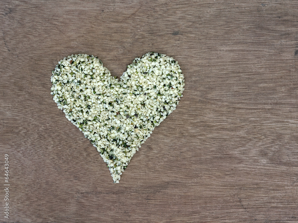 Shelled hemp seeds shaped in a heart symbol Shelled hemp seeds shaped in a heart symbol
